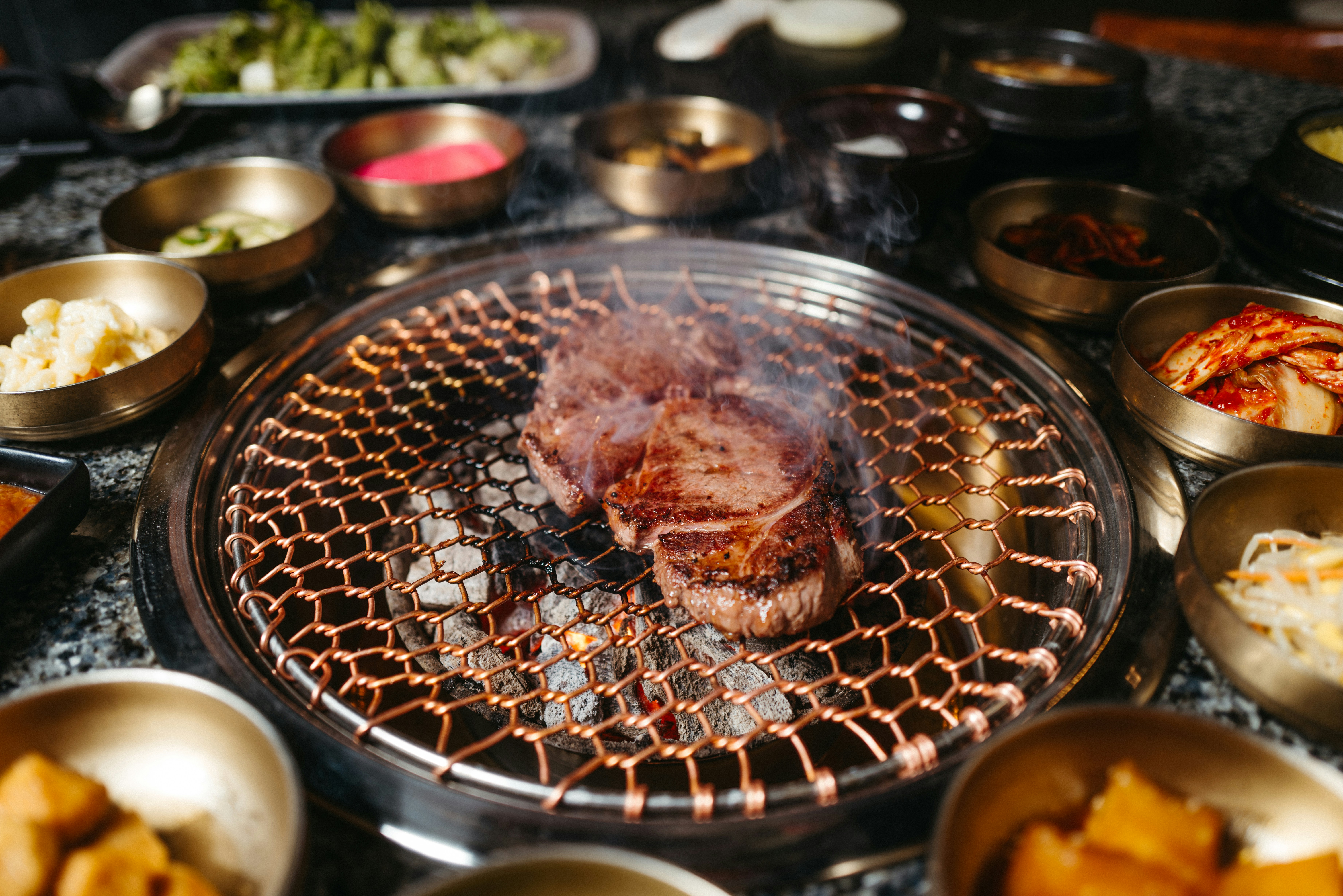 Meat grilling at Korean BBQ.